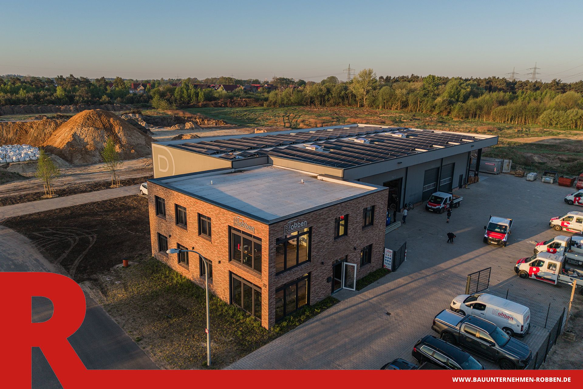 Firmensitz Bauunternehmen Robben 1 Bürogebäude mit Arbeitshalle und Lagerplatz der Bauunternehmen Robben GmbH.